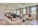 Open living room and kitchen with white sofas and a wooden coffee table at 410 Newland Way, Acworth, GA 30102