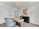 Home office with white desk, chair, and dark wood dresser at 410 Newland Way, Acworth, GA 30102