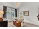 Home office with wood-like flooring, a desk, and shiplap wall at 410 Newland Way, Acworth, GA 30102