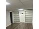 Finished basement with built-in shelving at 904 Little River Ln, Woodstock, GA 30189