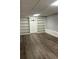 Finished basement with built-in shelving at 904 Little River Ln, Woodstock, GA 30189