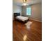 Bedroom with hardwood floors and a twin bed at 904 Little River Ln, Woodstock, GA 30189