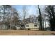 Ranch style home with mature trees and a spacious yard at 904 Little River Ln, Woodstock, GA 30189