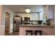 Kitchen with white cabinets and granite countertops at 904 Little River Ln, Woodstock, GA 30189