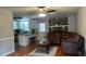 Living room with brown leather sectional and stone fireplace at 904 Little River Ln, Woodstock, GA 30189