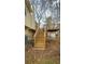 Wooden stairs leading to a deck at 904 Little River Ln, Woodstock, GA 30189