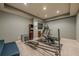 Finished basement gym with elliptical, treadmill and weight machine at 9994 Inisfree Dr, Johns Creek, GA 30022