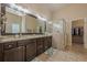 Spa-like bathroom with double vanity, large shower, and granite countertops at 9994 Inisfree Dr, Johns Creek, GA 30022