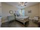 Comfortable bedroom with hardwood floors, ceiling fan, and plenty of natural light at 9994 Inisfree Dr, Johns Creek, GA 30022