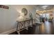 Elegant entryway with dark hardwood floors and a rustic console table at 9994 Inisfree Dr, Johns Creek, GA 30022