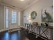 Elegant entryway with dark hardwood floors and a rustic console table at 9994 Inisfree Dr, Johns Creek, GA 30022