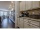 Well-equipped kitchen boasts granite countertops and ample cabinetry at 9994 Inisfree Dr, Johns Creek, GA 30022