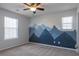 Bedroom with mountain mural and ceiling fan at 104 Holly Mill Village Dr, Canton, GA 30114