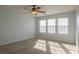 Spacious bedroom with ceiling fan and neutral carpeting at 104 Holly Mill Village Dr, Canton, GA 30114