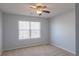 Bright bedroom with neutral walls, carpet, and ceiling fan at 104 Holly Mill Village Dr, Canton, GA 30114