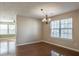 Bright dining room with hardwood floors and a chandelier at 104 Holly Mill Village Dr, Canton, GA 30114