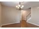 Bright dining room with hardwood floors and elegant chandelier at 104 Holly Mill Village Dr, Canton, GA 30114