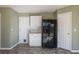 Kitchen with white cabinets and black appliances at 104 Holly Mill Village Dr, Canton, GA 30114