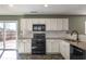 Kitchen boasts granite countertops and updated appliances at 104 Holly Mill Village Dr, Canton, GA 30114