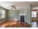 Bright living room with hardwood floors and corner fireplace at 104 Holly Mill Village Dr, Canton, GA 30114