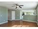 Open living room with hardwood floors and a view of the kitchen at 104 Holly Mill Village Dr, Canton, GA 30114