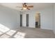 Large main bedroom with ceiling fan and access to bathroom at 104 Holly Mill Village Dr, Canton, GA 30114