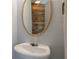 Small bathroom with pedestal sink and rustic wood wall at 104 Holly Mill Village Dr, Canton, GA 30114