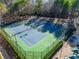 Two tennis courts with surrounding fence at 104 Holly Mill Village Dr, Canton, GA 30114