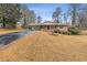 Ranch home with a paved driveway and yard at 1151 Mohican Trl, Stone Mountain, GA 30083