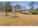 Brick ranch house on a large lot with landscaping at 1151 Mohican Trl, Stone Mountain, GA 30083