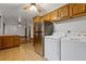 Kitchen with stainless steel refrigerator and laundry hookups at 1151 Mohican Trl, Stone Mountain, GA 30083