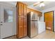 Kitchen with stainless steel refrigerator and pantry at 1151 Mohican Trl, Stone Mountain, GA 30083