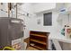 Laundry area with shelving, water heater, and storage at 1151 Mohican Trl, Stone Mountain, GA 30083