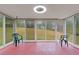 Sunroom with sliding glass doors and backyard view at 1151 Mohican Trl, Stone Mountain, GA 30083