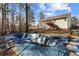 View of the home's backyard with a large, in-ground pool under repair and mature trees nearby at 1620 Cedar Hl, Douglasville, GA 30134