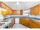 Kitchen with light wood cabinets and granite countertops at 1620 Cedar Hl, Douglasville, GA 30134