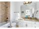 Bathroom with shower/tub combo and granite countertop vanity at 1696 Windsor Ne Pkwy, Atlanta, GA 30319