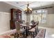 Formal dining room with a glass-top table and chandelier at 1696 Windsor Ne Pkwy, Atlanta, GA 30319