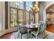 Bright dining room with a round table and view of the backyard at 1696 Windsor Ne Pkwy, Atlanta, GA 30319