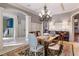 Elegant dining room featuring a glass table, chandelier, and comfortable seating at 1696 Windsor Ne Pkwy, Atlanta, GA 30319