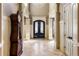 Grand entry with a tiled floor and a stately grandfather clock at 1696 Windsor Ne Pkwy, Atlanta, GA 30319