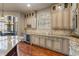 Eat-in kitchen with granite countertops and custom cabinetry at 1696 Windsor Ne Pkwy, Atlanta, GA 30319