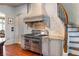 Modern kitchen with stainless steel appliances and a custom range hood at 1696 Windsor Ne Pkwy, Atlanta, GA 30319