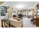 Elegant living room with fireplace, built-in shelving, and piano at 1696 Windsor Ne Pkwy, Atlanta, GA 30319