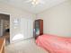 Small bedroom with window, closet and ceiling fan at 1843 Riverton Dr, Suwanee, GA 30024