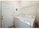 Laundry room with washer, dryer and exterior access at 1843 Riverton Dr, Suwanee, GA 30024