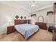 Spacious main bedroom with carpeted floors and ceiling fan at 1843 Riverton Dr, Suwanee, GA 30024