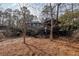 House backyard with wooden gazebo and tree coverage at 3894 Foxford Dr, Atlanta, GA 30340