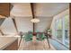 Bright dining area with wood table, teal chairs, and access to a deck at 3894 Foxford Dr, Atlanta, GA 30340