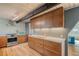 Modern kitchen with upper wood cabinets, geometric backsplash and quartz countertops at 3894 Foxford Dr, Atlanta, GA 30340